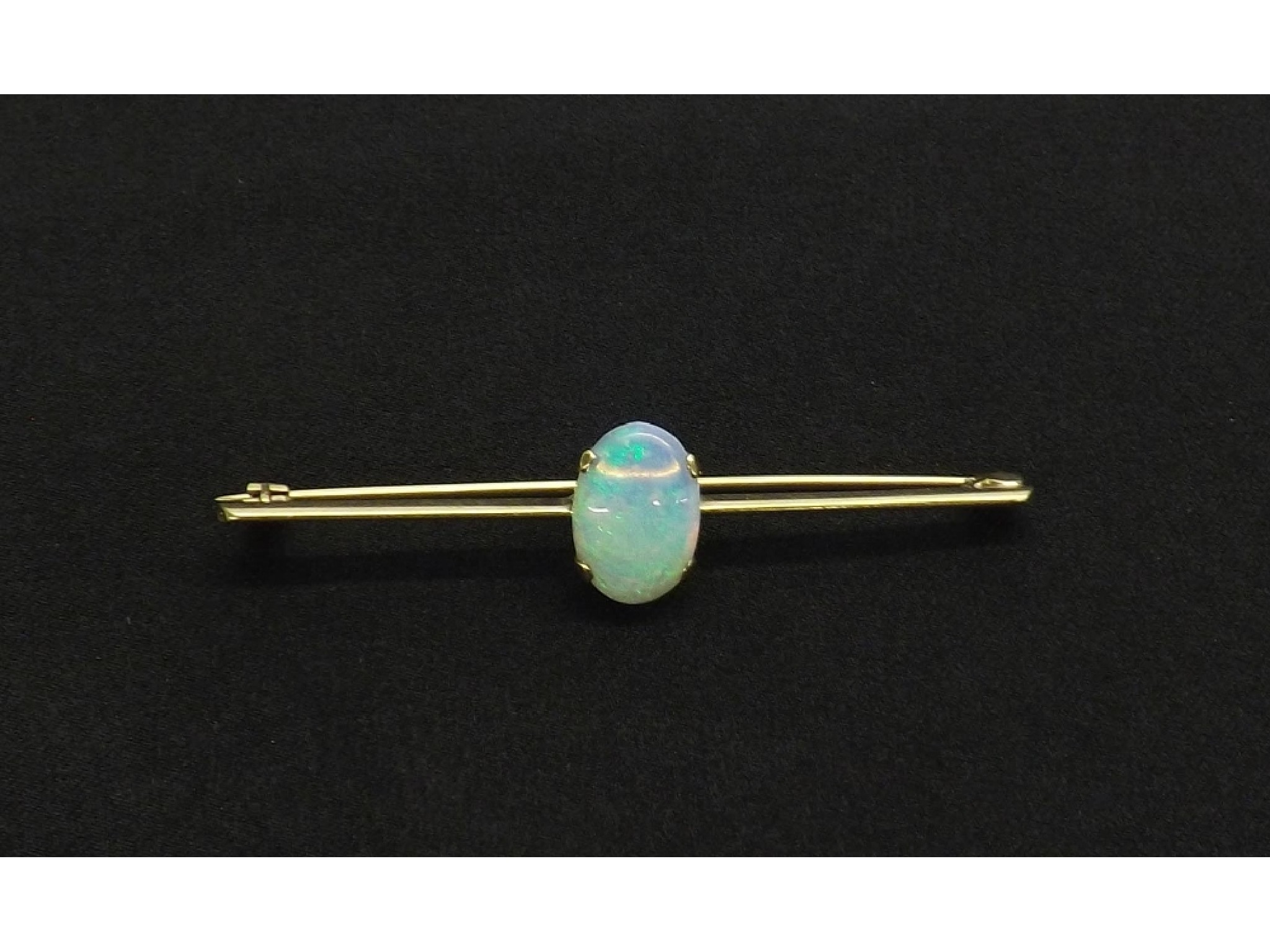 Appraisal: Gold mounted opal bar brooch the opal mm x mm