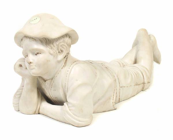 Appraisal: An Italian carved Carrara marble figure of a reclining boy