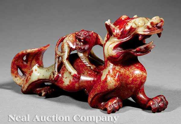 Appraisal: A Chinese Archaistic Celadon and Russet Red Jade Dragon Group