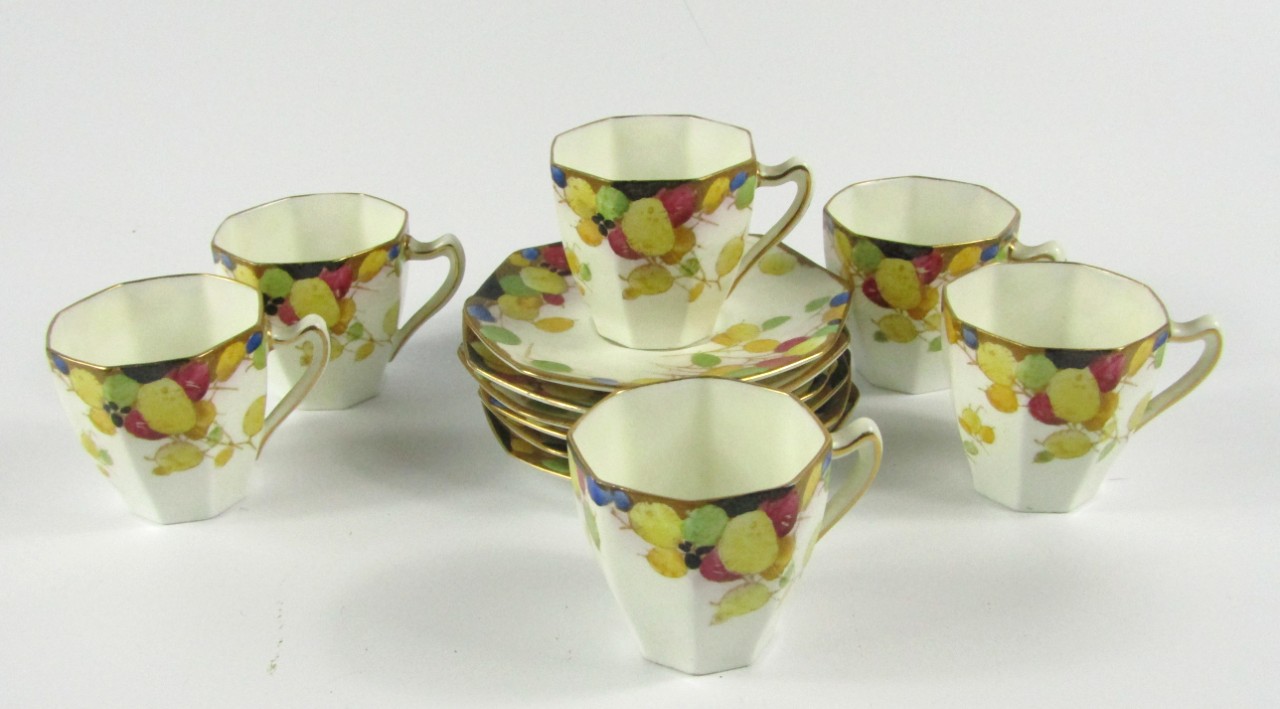 Appraisal: A Royal Doulton porcelain part coffee service painted with fruit