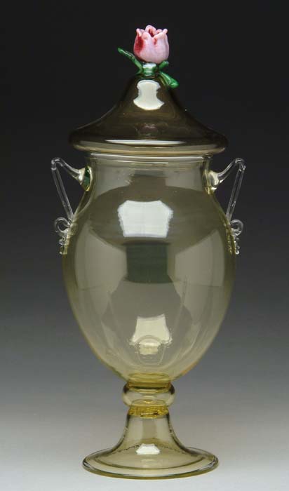 Appraisal: ART GLASS COVERED JAR Pale yellow coloring with two applied