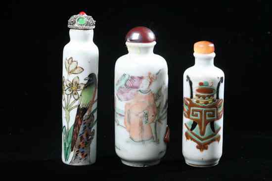 Appraisal: THREE CHINESE FAMILLE ROSE PORCELAIN ROULEAU SNUFF BOTTLES Painted with