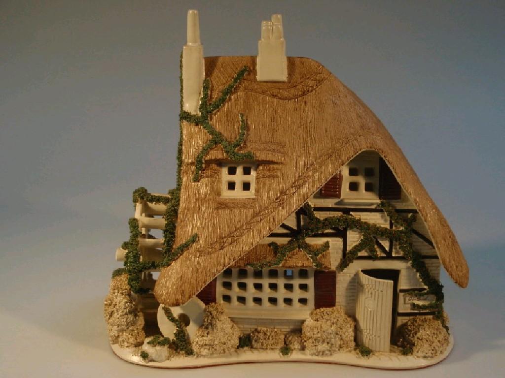 Appraisal: A Canziani pottery model of a thatched cottage cm high