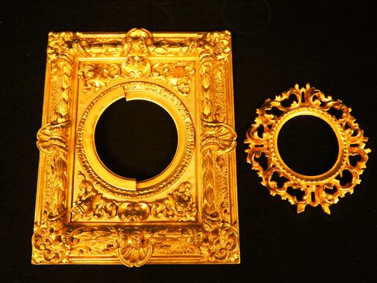 Appraisal: Two gilt frames rectangular with circular opening molded scrolls and