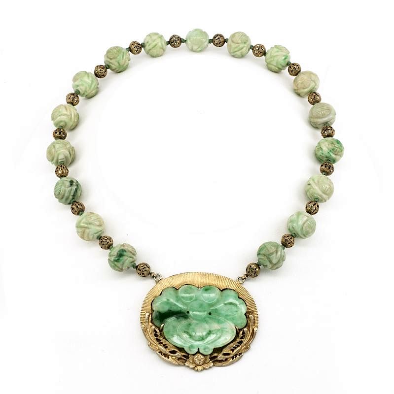 Appraisal: Carved jade and gilt necklace Carved jade and gilt necklace