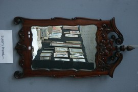 Appraisal: A carved wood mirror in Victorian taste