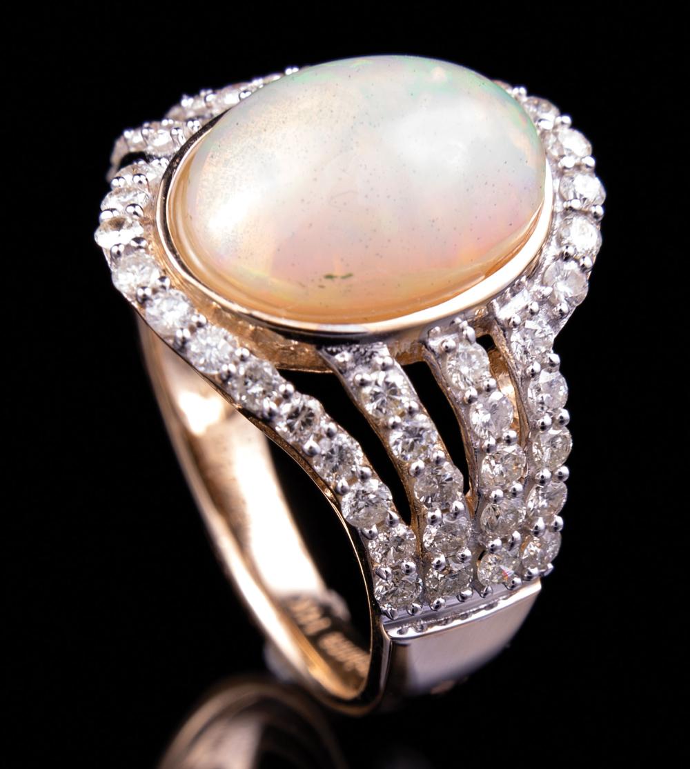 Appraisal: kt Yellow Gold Opal and Diamond Ring bezel set oval