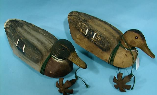 Appraisal: Pair of Herters Mallard decoys with original weights and bottom