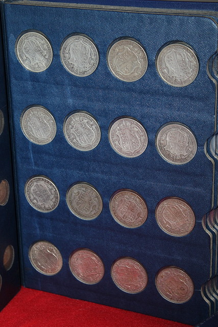 Appraisal: AN ALBUM OF COINS including half crowns in silver and