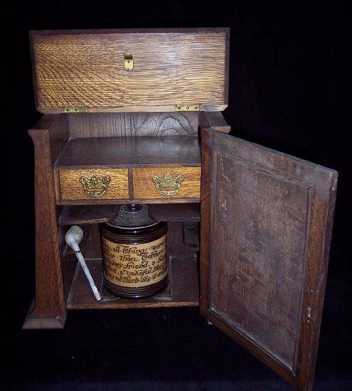 Appraisal: A smoker's early th Century oak cabinet fitted drawers two