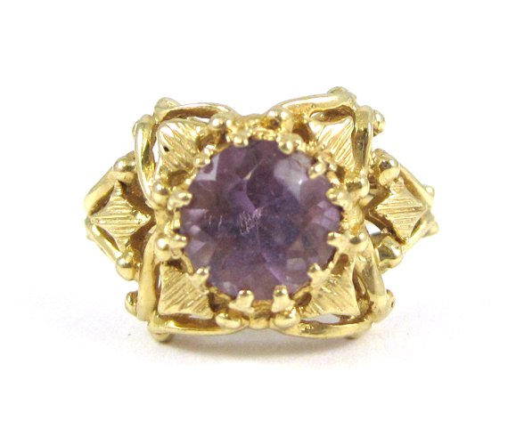 Appraisal: AMETHYST AND FOURTEEN KARAT GOLD RING set with a single