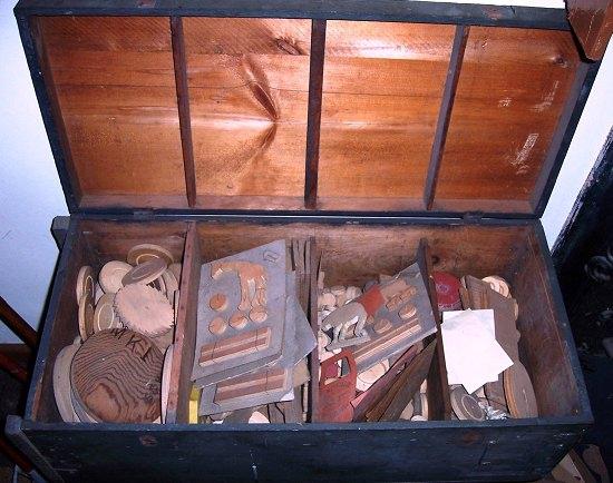 Appraisal: A toymaker's chest containing wooden and metal templates a folio