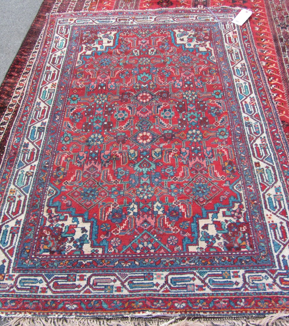 Appraisal: A Saraband rug Persian the madder field with an all