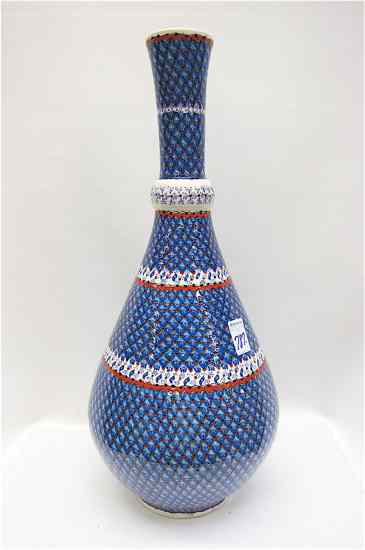 Appraisal: TURKISH POTTERY HAND VASE hand enameled in the ''Tears of