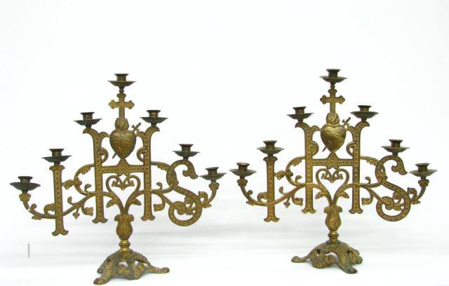 Appraisal: Pair of Religious Candelabra each is seven branch with cross