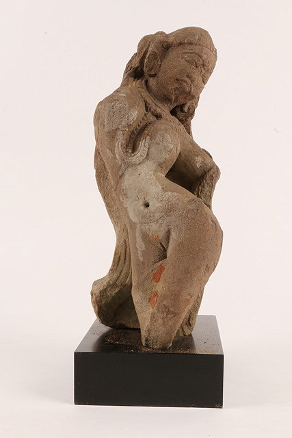 Appraisal: AN ANTIQUE INDIAN CARVED SANDSTONE MODEL of a female Deity