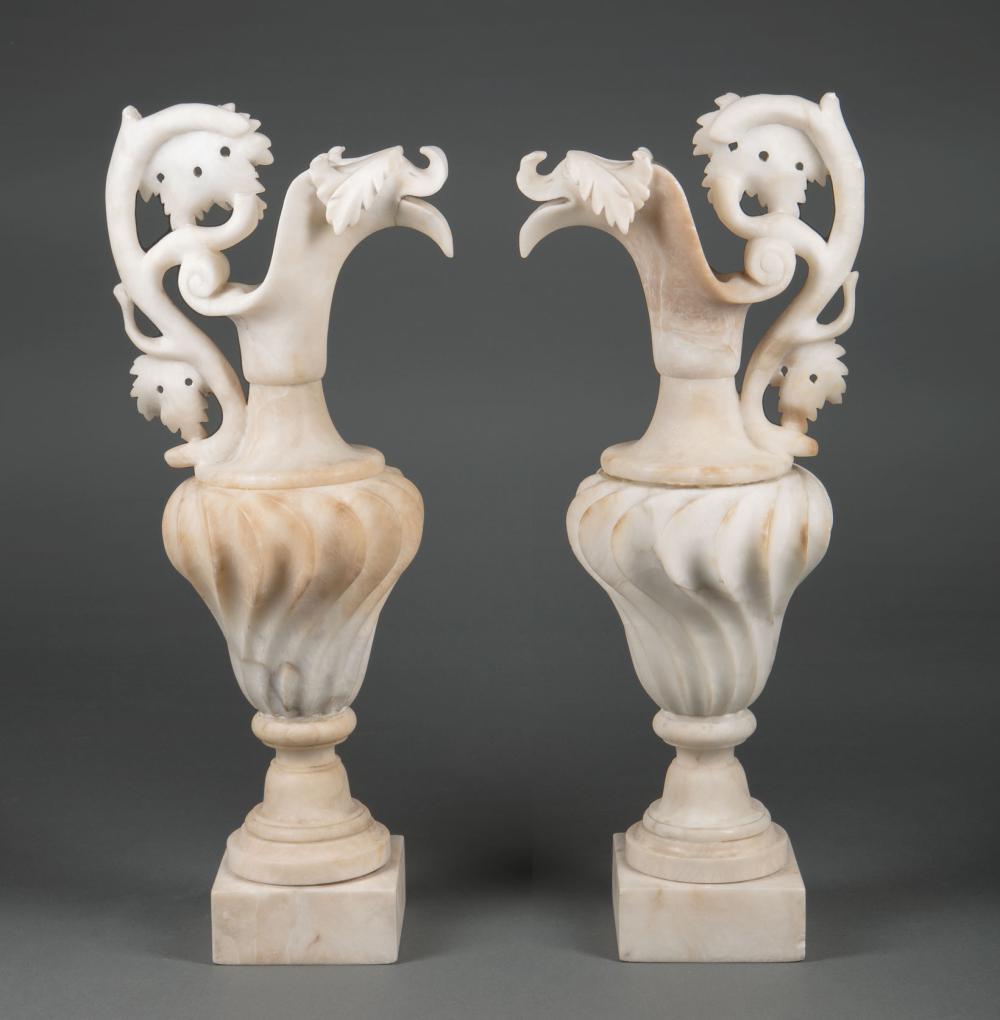 Appraisal: Pair of Italian Carved Alabaster Ewers c foliate handles spiral