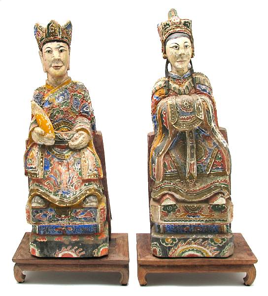 Appraisal: A pair of Chinese polychrome wood figures of an Emperor