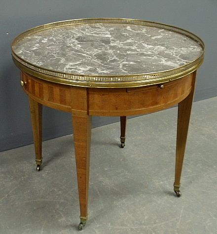 Appraisal: - French style round table with a brass galleried marble