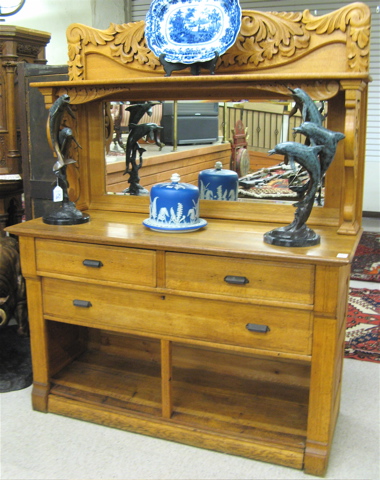 Appraisal: LATE VICTORIAN OAK SIDEBOARD American c with carved mirror-panel top