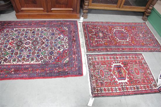 Appraisal: THREE ORIENTAL STYLE RUGS All area rugs with red grounds