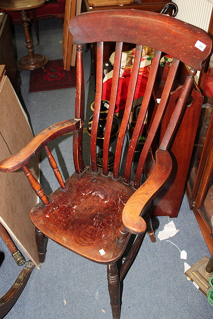 Appraisal: A OLD ELM LATHBACK WINDSOR ARMCHAIR standing on turned legs