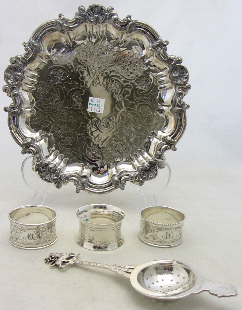 Appraisal: A pair of silver napkin rings with scroll engraved decoration