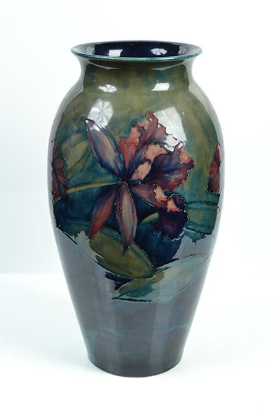 Appraisal: A MOORCROFT ORCHID PATTERN VASE baluster in form decorated with