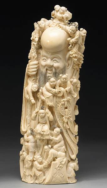 Appraisal: An ivory carving of Shoulao and boys th Century The