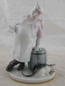 Appraisal: A Soviet Russian ceramic group of a cook with a