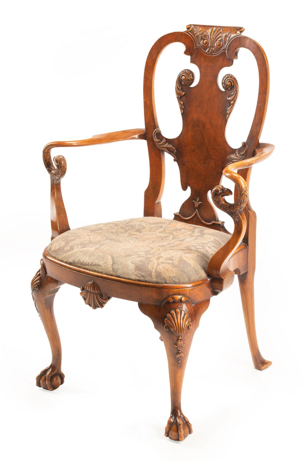 Appraisal: George II-Style Carved Walnut Armchair shell-carved crest vasiform splat shaped