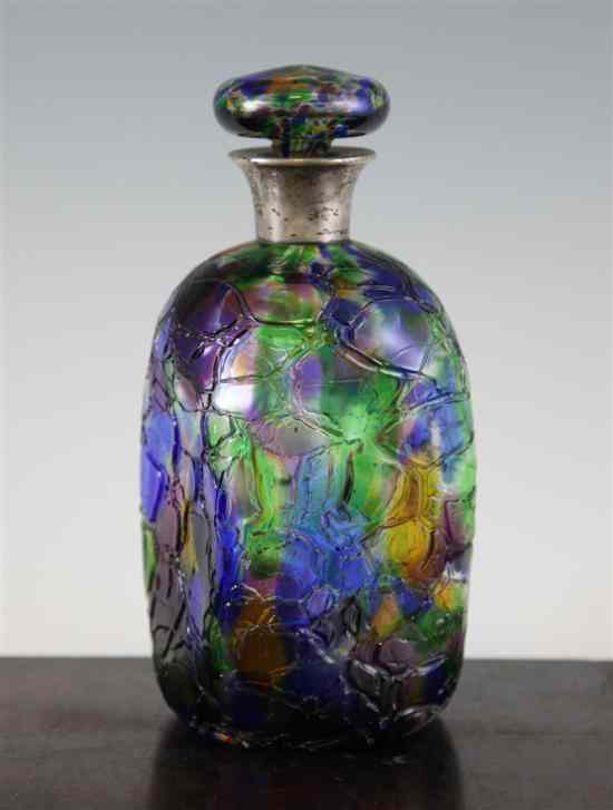 Appraisal: An unusual amber green blue and purple tinted glass decanter