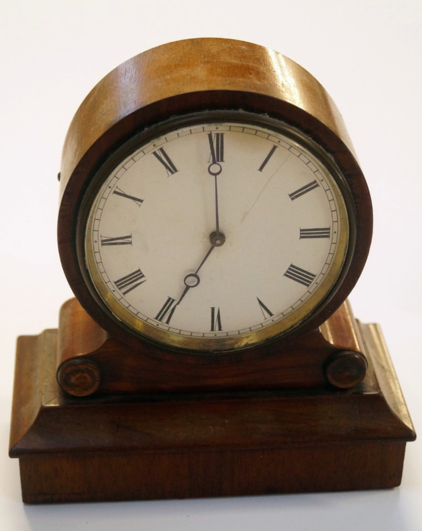 Appraisal: A thC walnut cased mantel clock the circular cm dia