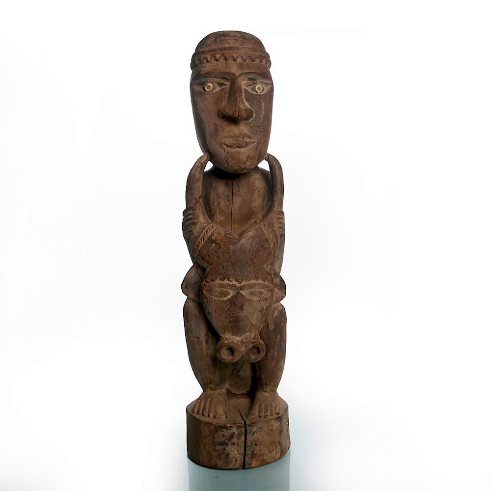 Appraisal: AFRICAN TRIBAL WOODEN SCULPTURE OF MAN WITH BULLS HEAD Antique