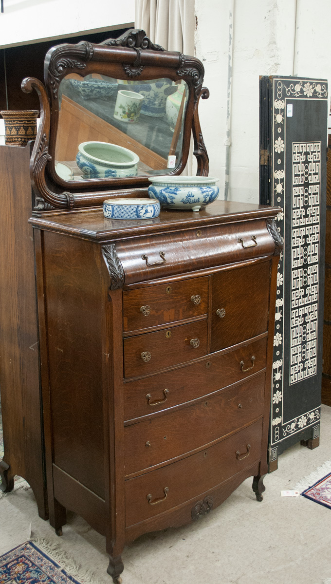 Appraisal: TALL OAK CHIFFONIER American c a tall chest of six