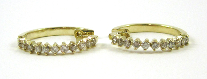 Appraisal: PAIR OF DIAMOND AND FOURTEEN KARAT GOLD EARRINGS each yellow