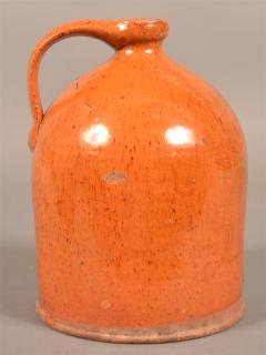 Appraisal: th Century Pumpkin Glazed Redware Jug h