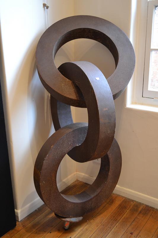 Appraisal: SCULPTURA TH CENTURY Interlocking rings corten steel SCULPTURA TH CENTURY