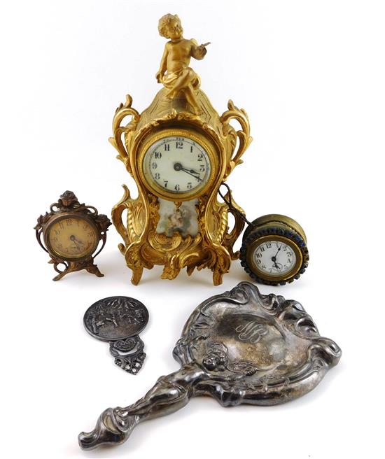 Appraisal: Rococo style clocks and silver plate vanity accessories five pieces