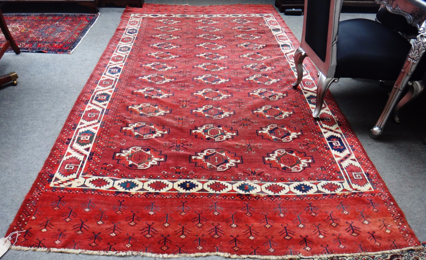 Appraisal: A Yumut carpet Turkeman the madder field with three columns