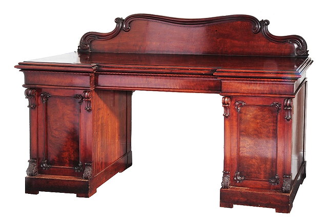 Appraisal: A th Century mahogany pedestal sideboardhaving a break front and