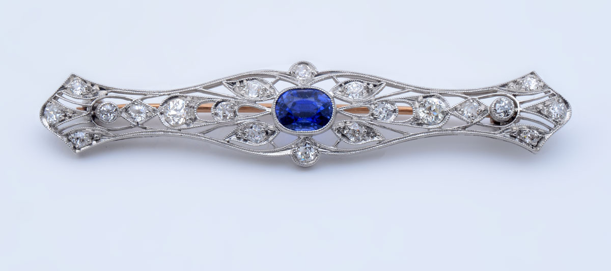 Appraisal: PLATINUM EDWARDIAN SAPPHIRE DIAMOND BROOCH Ultra fine pierce work is