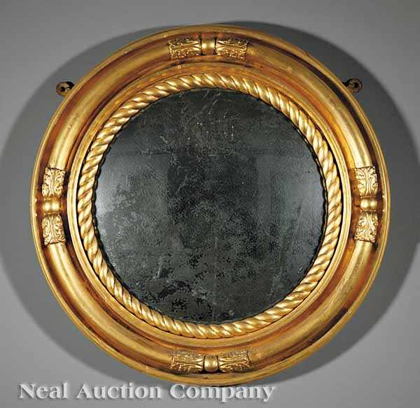 Appraisal: An English Carved and Gilded Convex Mirror th c circular