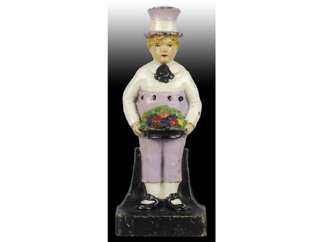 Appraisal: Boy with Fruit Basket Cast Iron Doorstop Description Great face