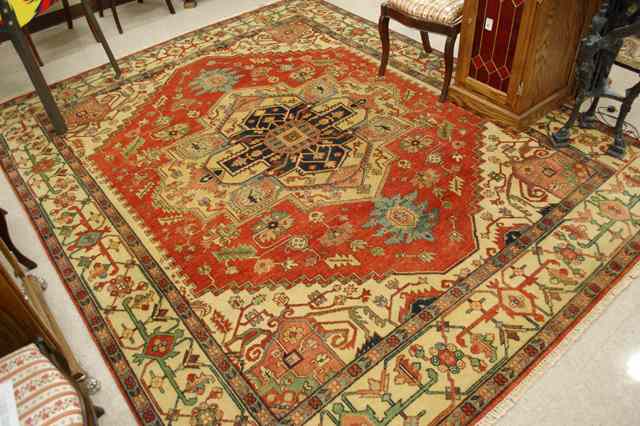 Appraisal: HAND KNOTTED ORIENTAL CARPET Persian Heriz design ' '' x