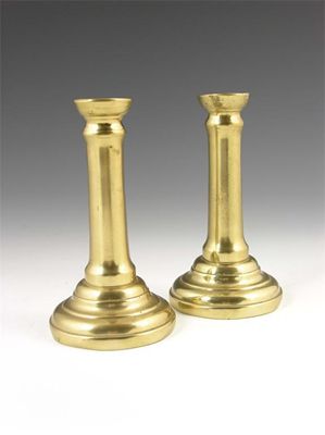 Appraisal: A pair of th century North European brass candlesticks with