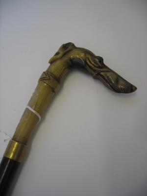 Appraisal: A EBONISED WALKING STICK the horn grip modelled as a