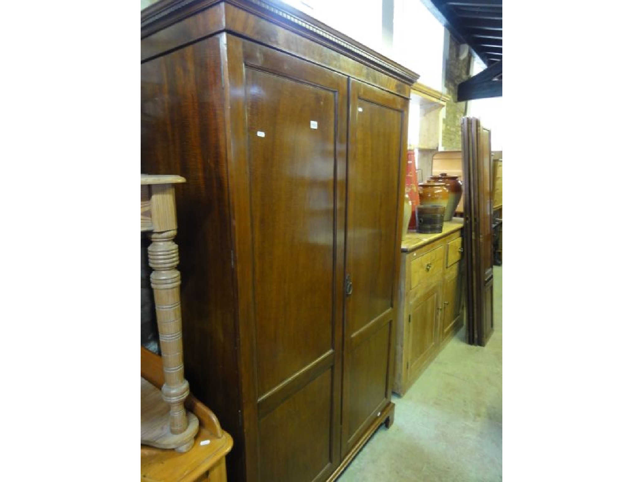 Appraisal: An Edwardian mahogany wardrobe in the Georgian style the moulded