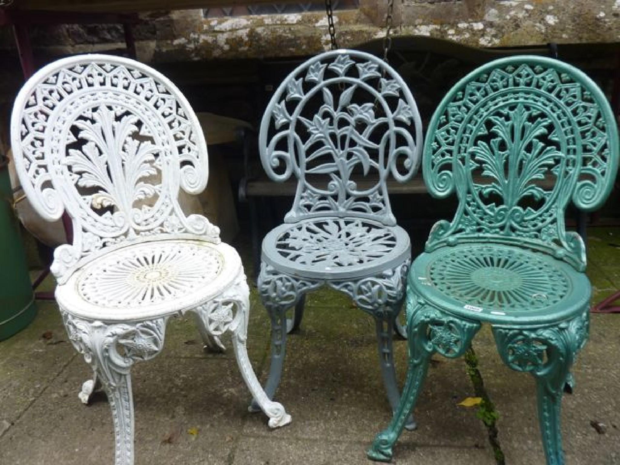 Appraisal: A pair of heavy cast iron garden chairs in the