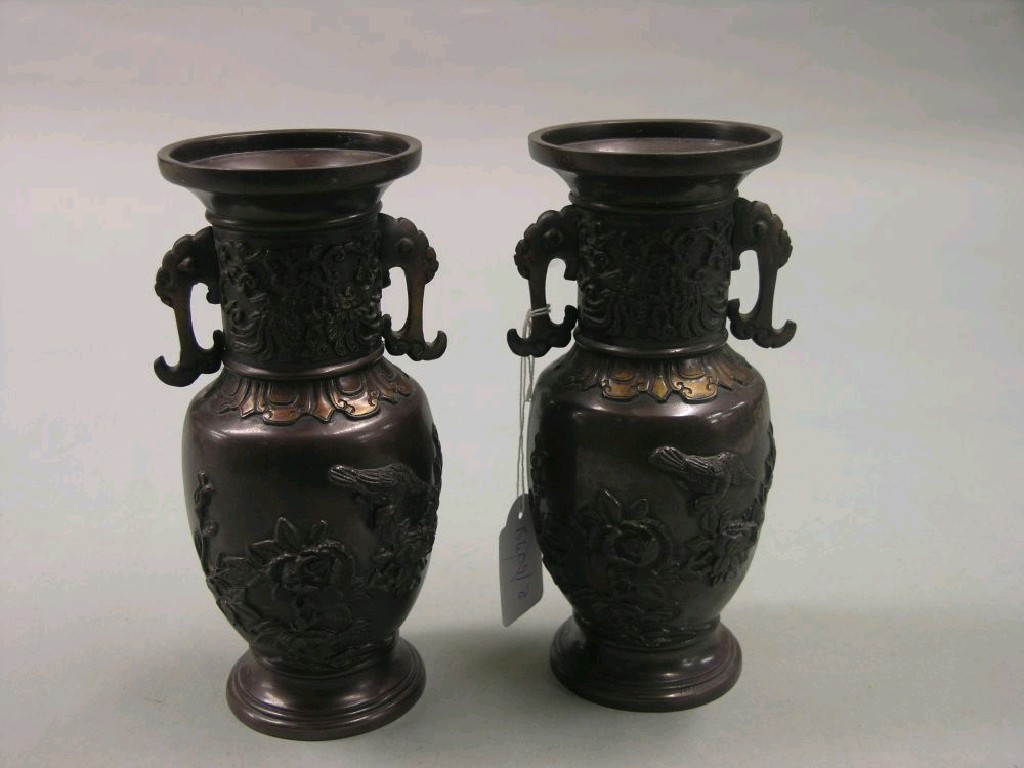 Appraisal: A pair of Japanese bronze vases baluster-shape with cast ornament